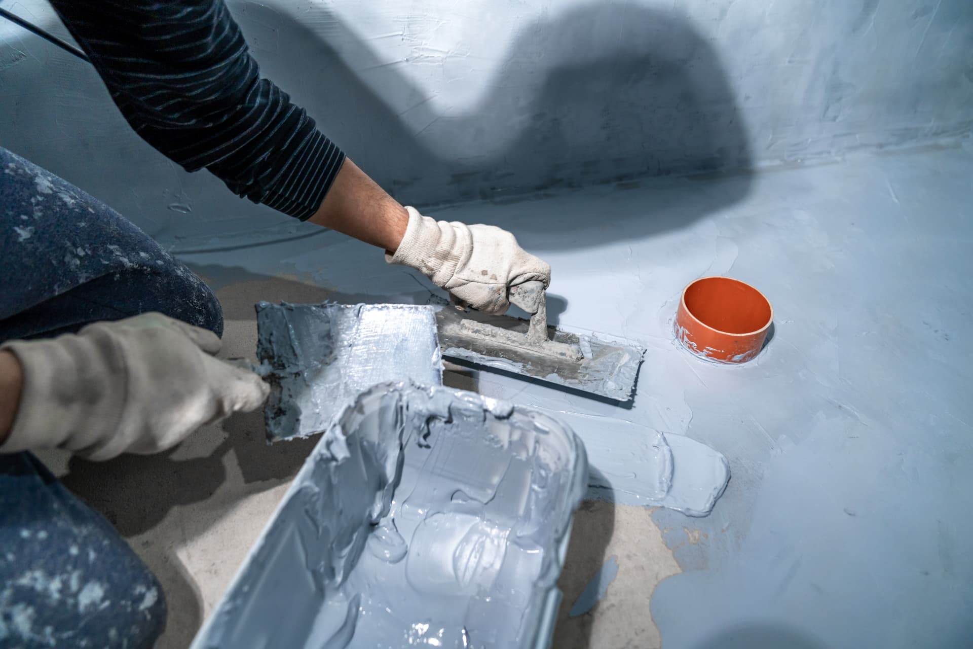 Waterproofing and tanking membrane being applied to a wet area floor before tiling in Kent
