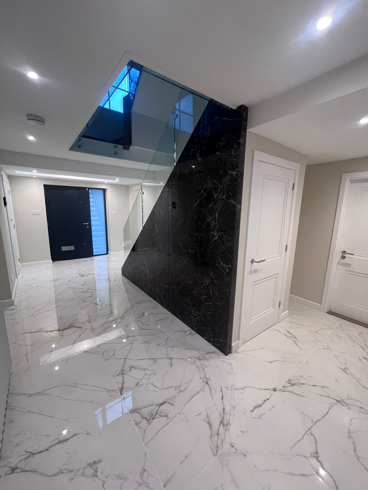 Marble floor tiling to a new-build hallway in Kent