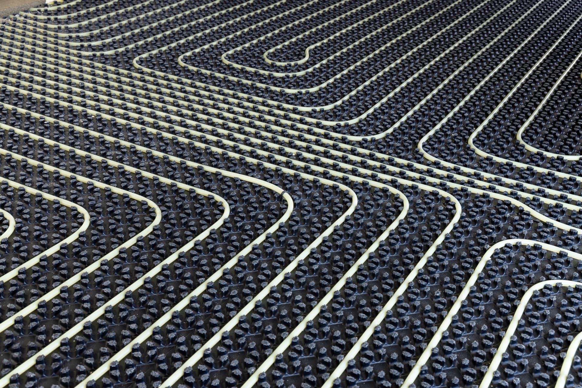 Electric underfloor heating cable laid in floor matting before tiling in Kent