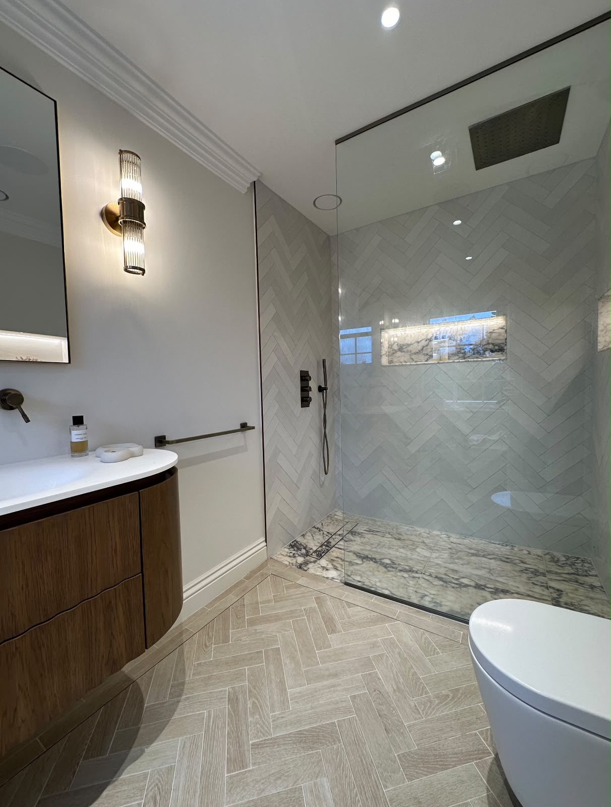 Herringbone floor tiling in a Kent bathroom by JB Tiling